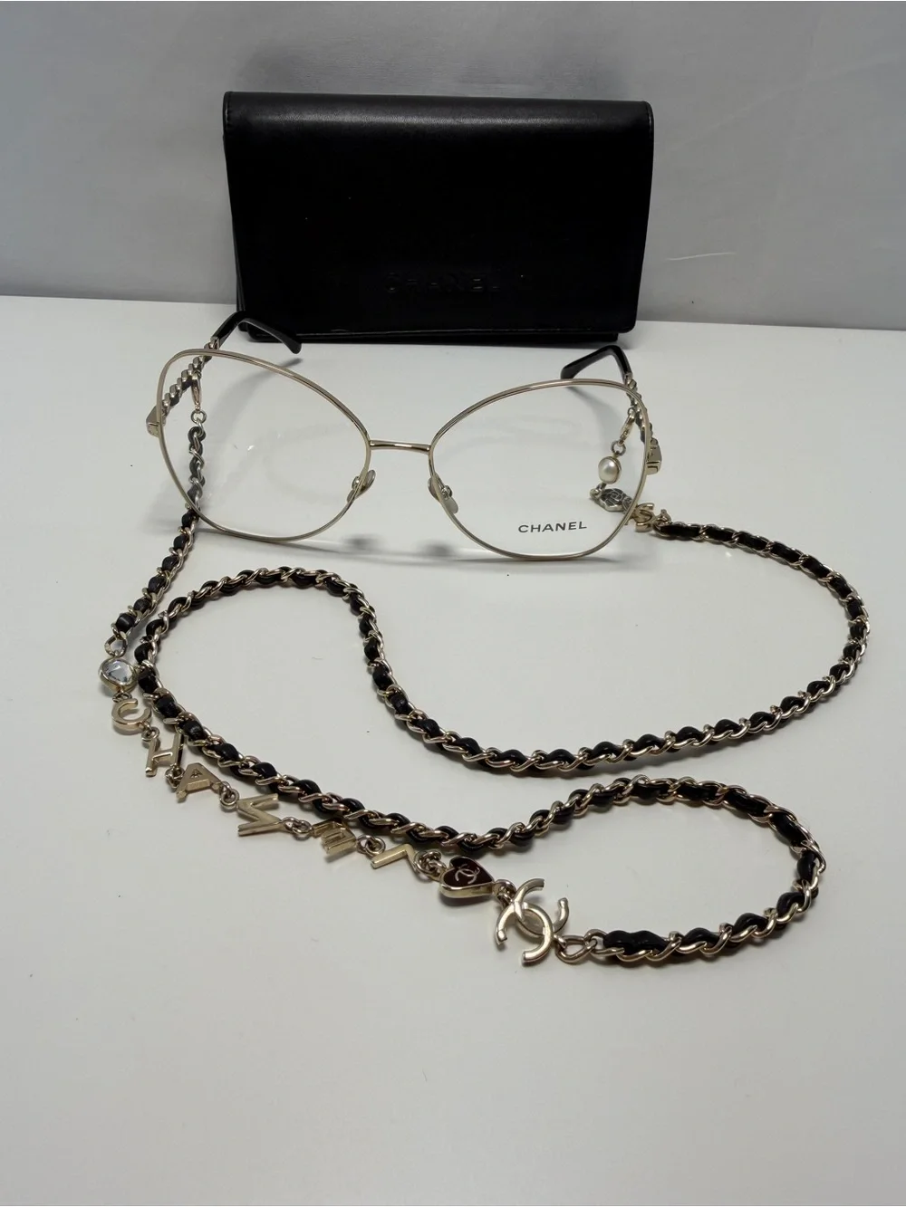 CHANEL  Gold and Black Eye ear Chain with Silver-Tone Glasses